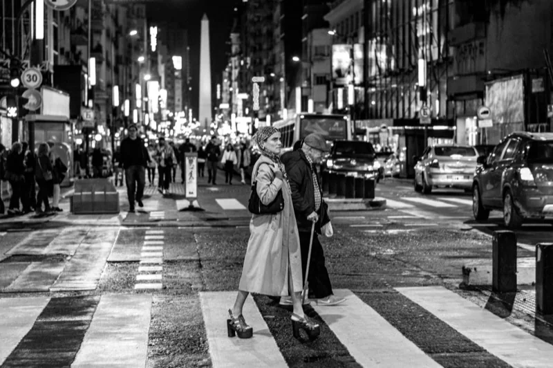 people crossing a street — illustrative editorial photography, not a verified location
