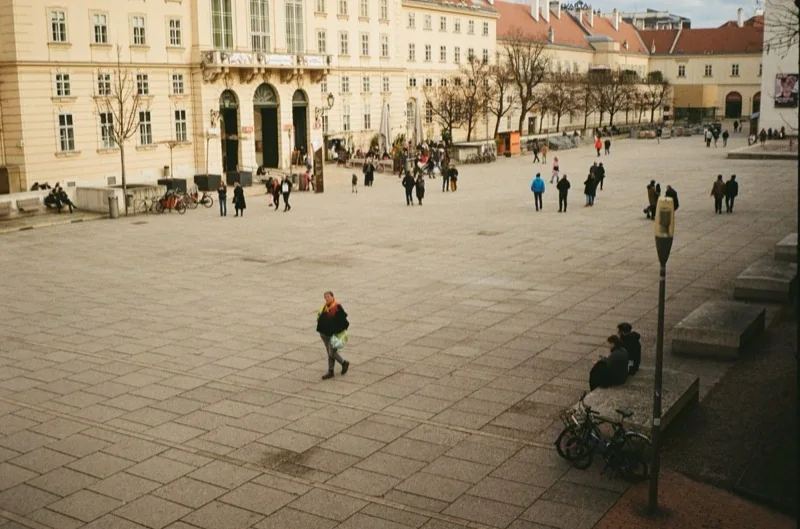 people walking on the town square — illustrative editorial photography, not a verified location