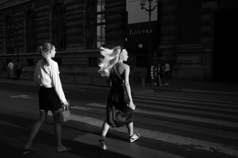 young women walking on a zebra street crossing paris france — illustrative editorial photography, not a verified location