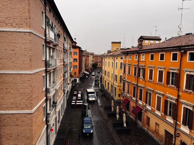 charming modena street view with colorful buildings — illustrative editorial photography, not a verified location