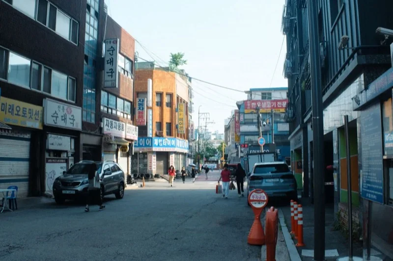 busy street scene in seoul s urban neighborhood — illustrative editorial photography, not a verified location