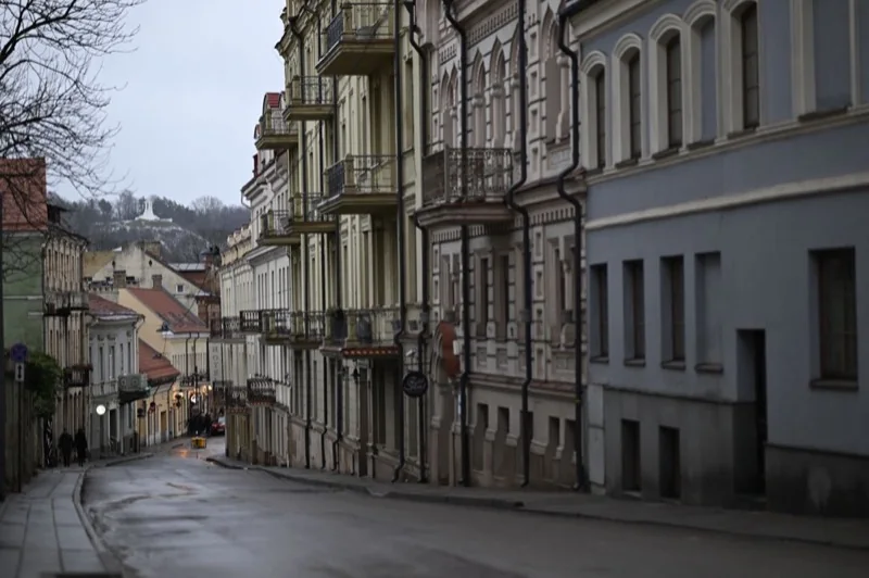 city street and old town townhouses — illustrative editorial photography, not a verified location