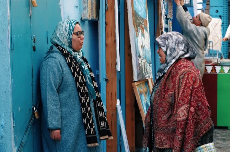 women in traditional attire in moroccan market — illustrative editorial photography, not a verified location