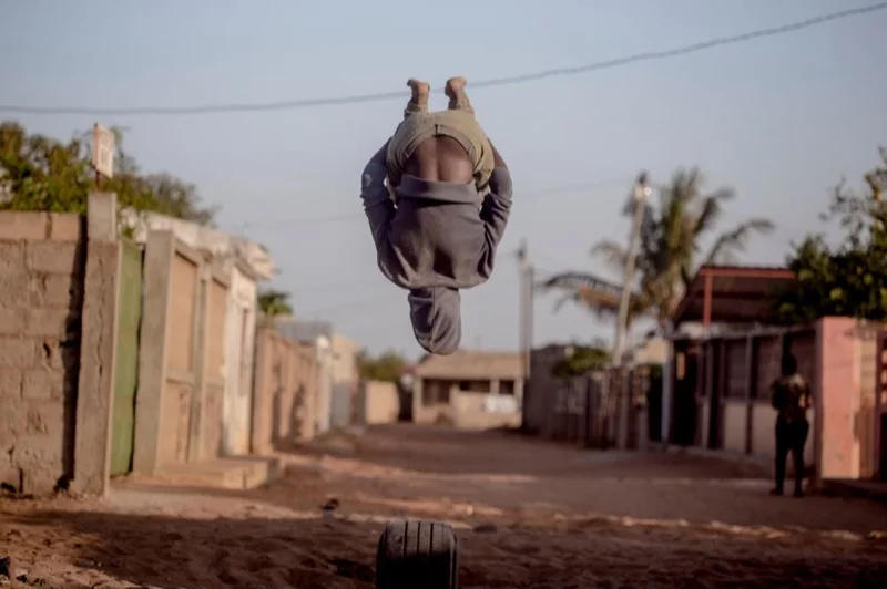 close up of a man doing a backflip — illustrative editorial photography, not a verified location