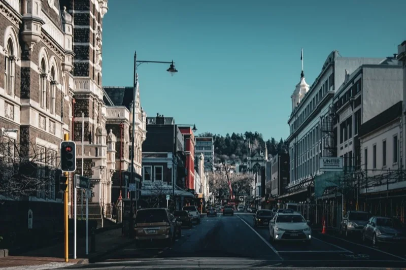 a city street with buildings and cars — illustrative editorial photography, not a verified location