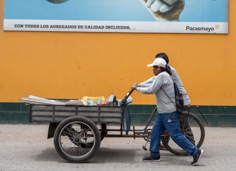 sidewalk scene with cart in trujillo peru — illustrative editorial photography, not a verified location