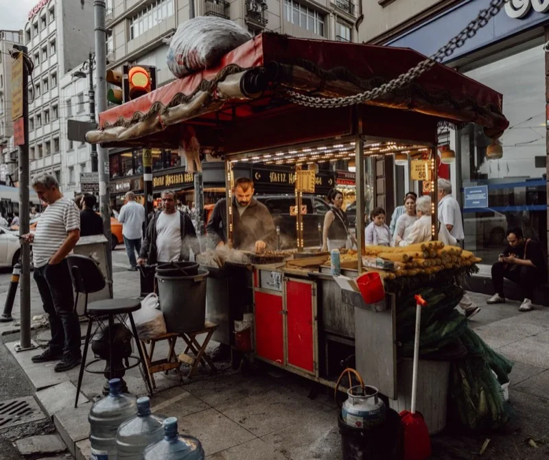 bustling street food vendor in urban setting — illustrative editorial photography, not a verified location