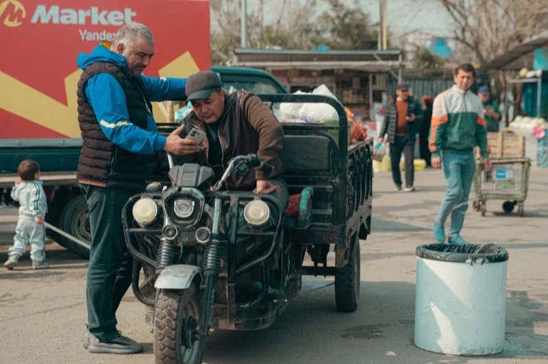 marketplace scene in uzbekistan with locals — illustrative editorial photography, not a verified location