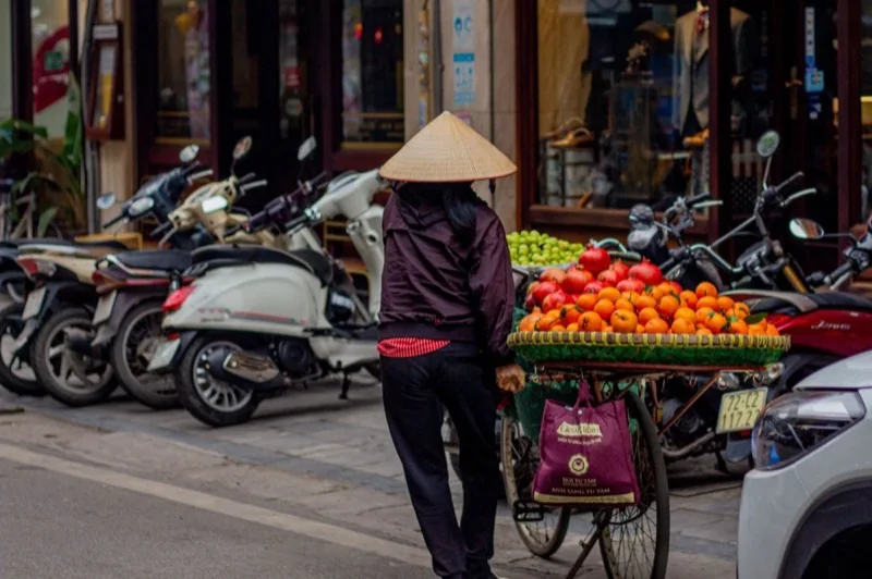 merchant with fruits on bicycle — illustrative editorial photography, not a verified location