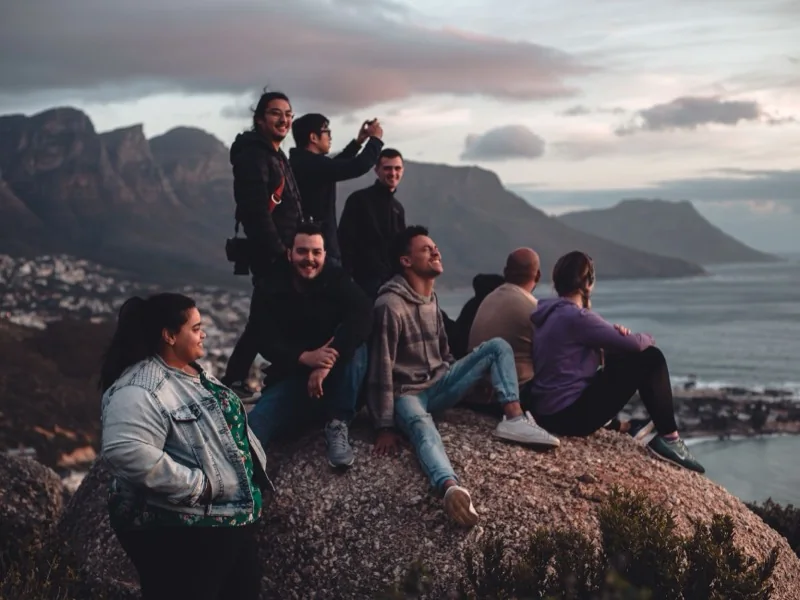Friends gathered on a rocky coastal lookout