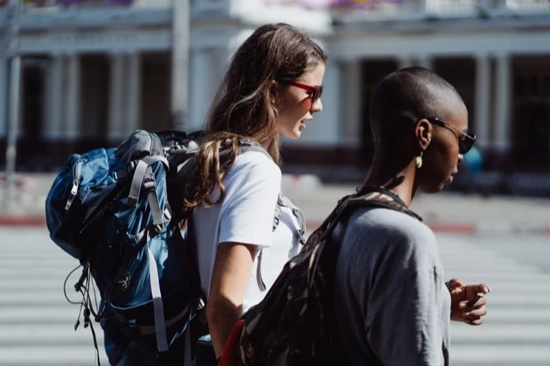Two travelers on a city street