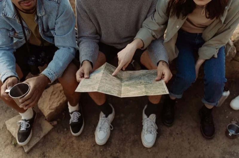 A group looking at a paper map together