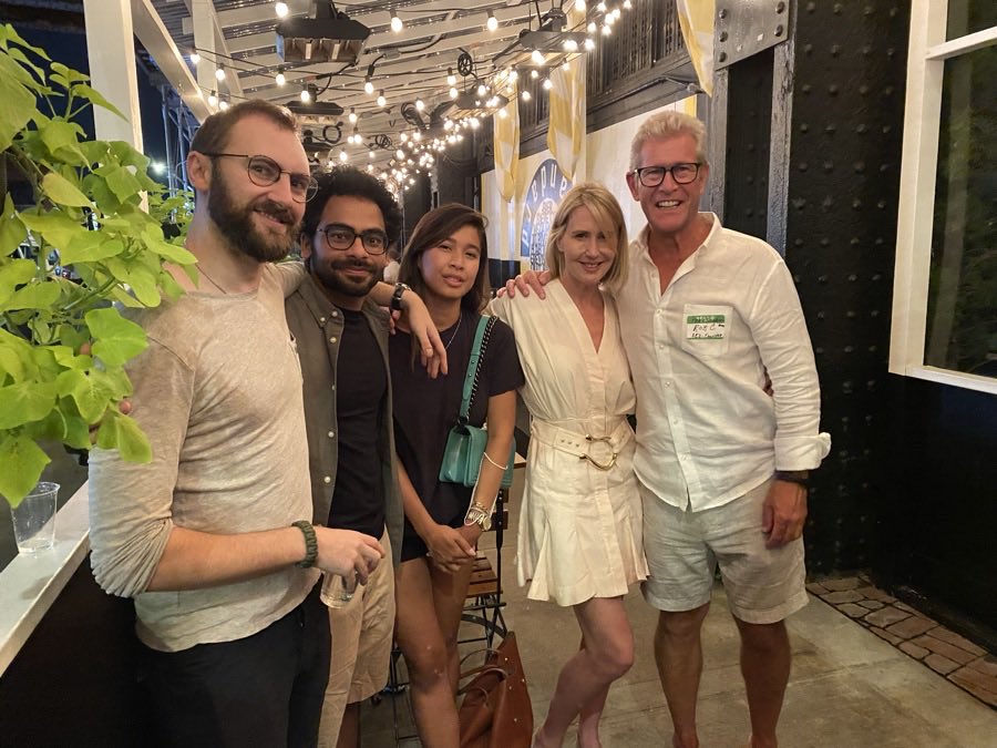 A group of friends together on a restaurant terrace